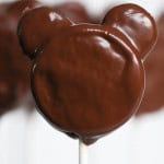 Close up of Mickey Oreo Cookie Pops covered in chocolate.