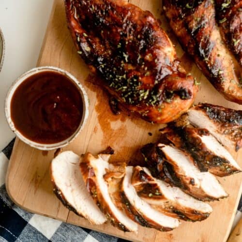 Sliced marinated root beer grilled chicken on a cutting board