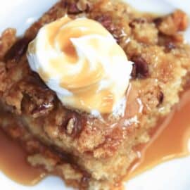 Pumpkin Pie Cake with whipped topping and caramel sauce