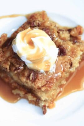 Pumpkin Pie Cake with whipped topping and caramel sauce