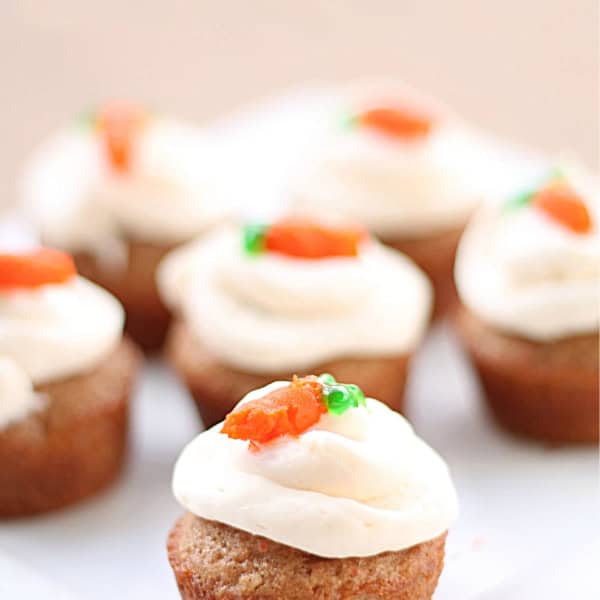 Several Bite Size Carrot Cakes on a cake stand.