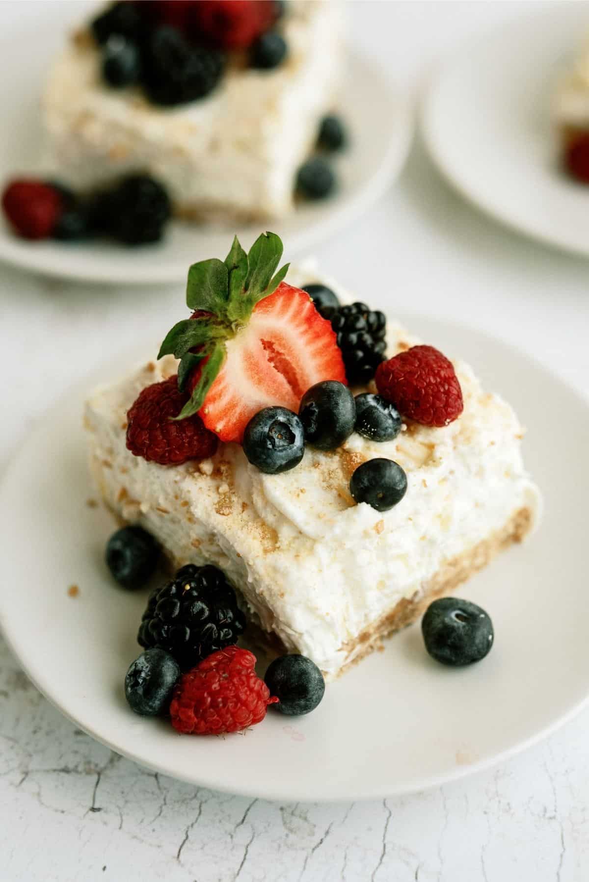 https://www.sixsistersstuff.com/wp-content/uploads/2014/04/Fluffy-Cream-Cheese-Dessert-1.jpg