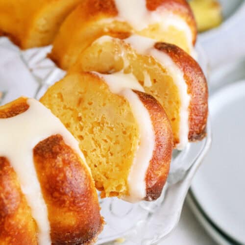 pineapple poke cake sliced on a plate