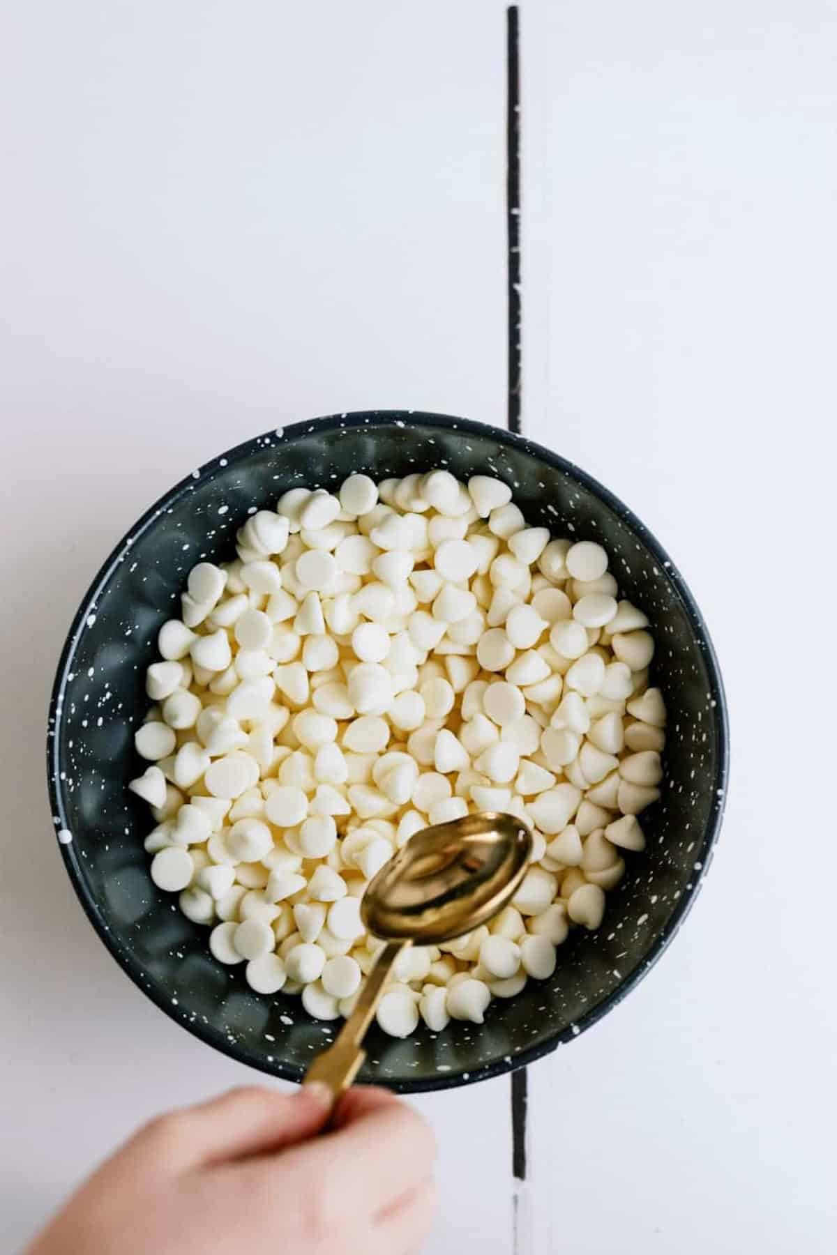 oil being poured on white chocolate chips