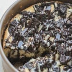 Cheesecake Factory Oreo Cheesecake in a springform pan with crushed oreos on top.