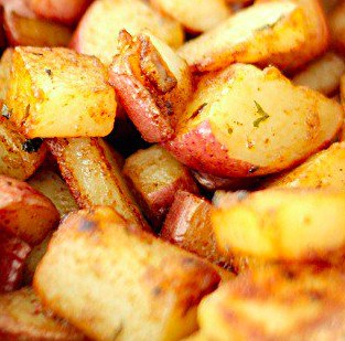 Skillet red potatoes chopped up and cooking