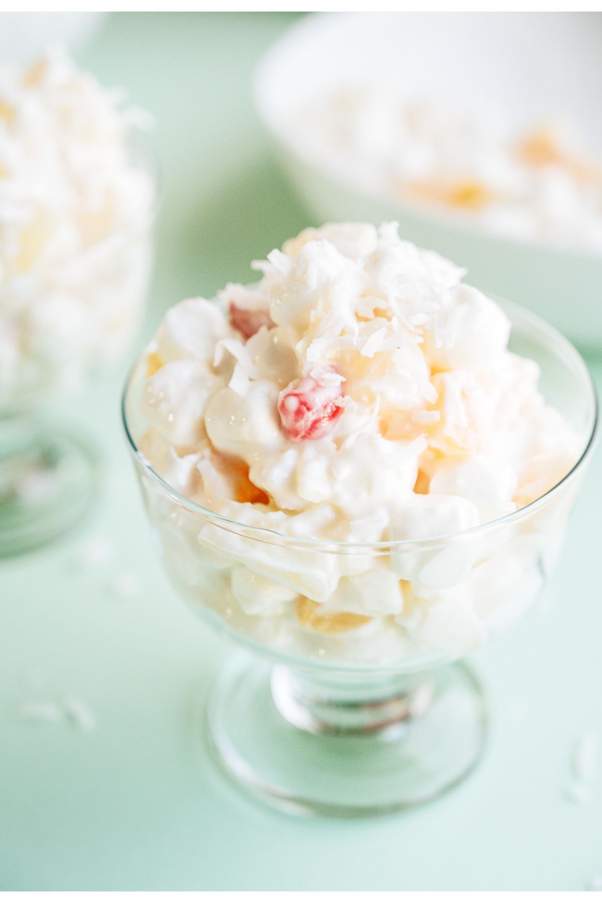 Close up of a glass filled with a serving of Easy Ambrosia Salad.