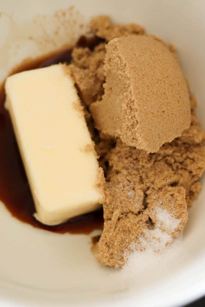 Vanilla, butter, sugar, and brown sugar in a mixing bowl.