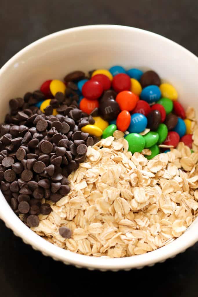 A bowl of chocolate chips, M&M's and Oats.