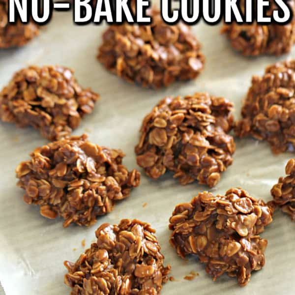 A tray of healthy no-bake cookies made with oats and chocolate, set on parchment paper.