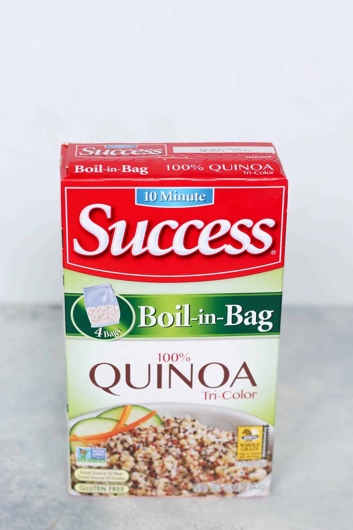 Box of Success Boil-in-Bag 100% Tri-Color Quinoa, featuring an image of quinoa with vegetables, labeled as gluten-free and a 10-minute cooking time.