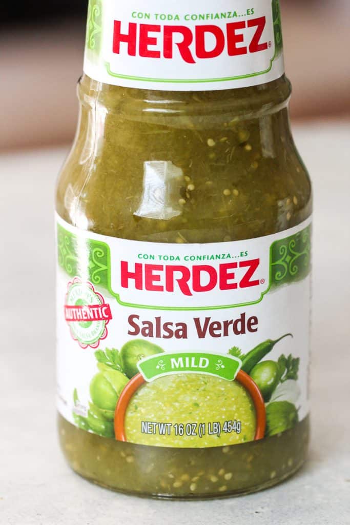 A 16 oz jar of Herdez Salsa Verde with a mild heat level. The label features green tomatillos and the phrase "Con toda confianza...es Herdez.