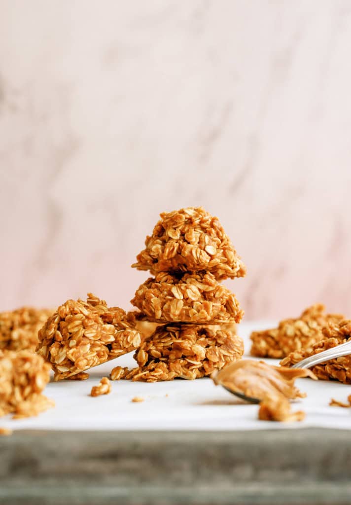 3 No-Bake Cookie Butter Cookies stacked, surrounded by other cookies.