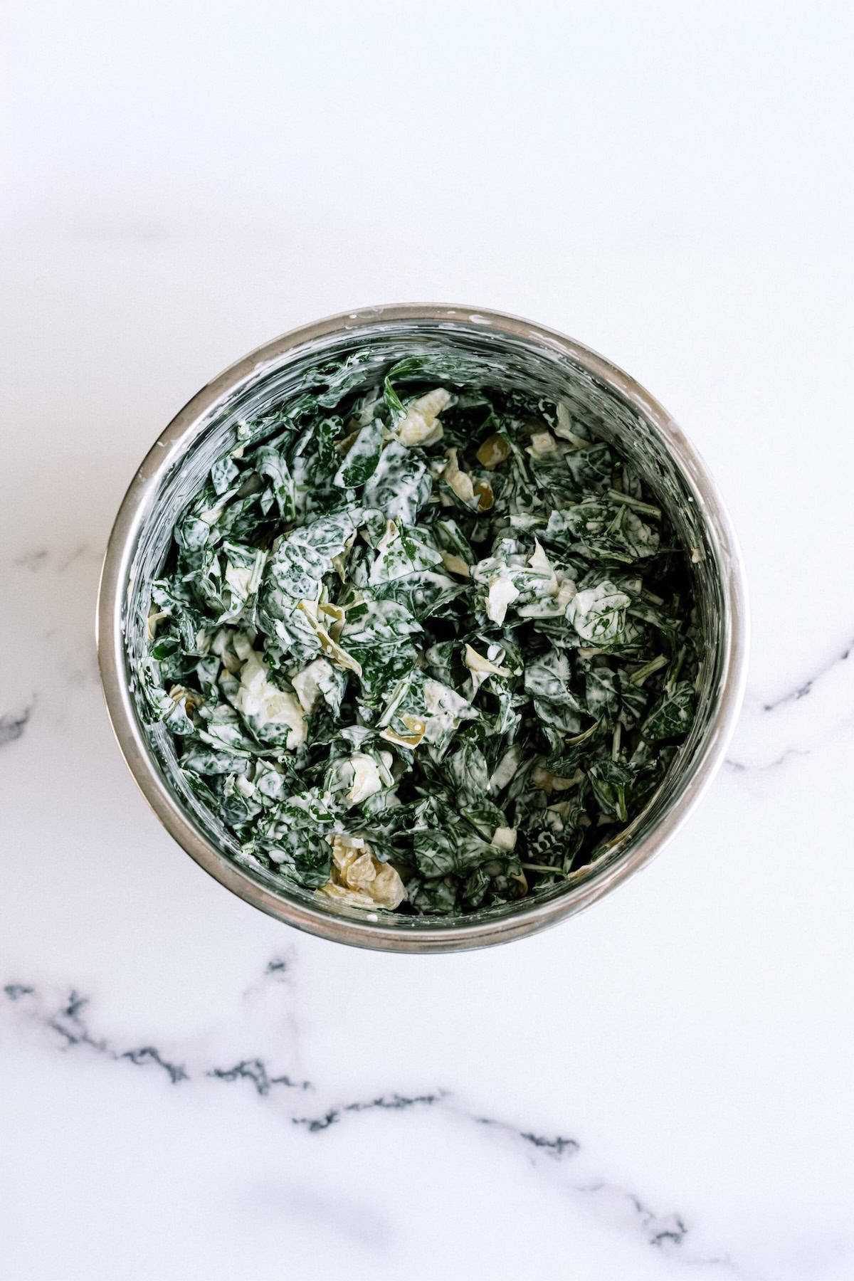 Instant Pot Spinach Artichoke dip after cooked and spinach is mixed in