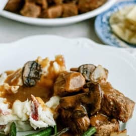 sirloin beef tips made in the Instant Pot served with potatoes and green beans