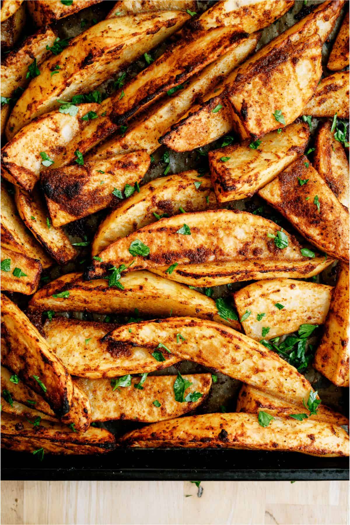 Oven Baked Seasoned Steak Fries on a sheet pan