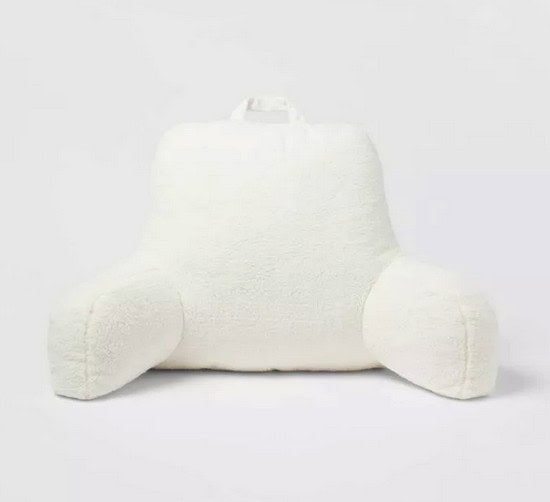 white fuzzy pillow for sitting up