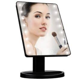 makeup mirror with woman\'s face shown, black edges