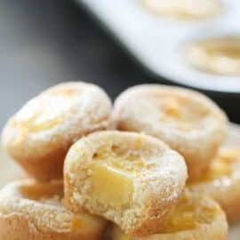 Lemon Bar Cookie Cups stacked on a plate