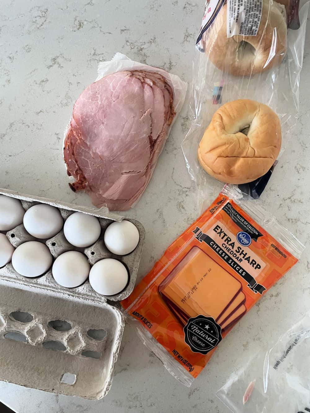 https://www.sixsistersstuff.com/wp-content/uploads/2022/03/Ingredients-for-Bagel-Breakfast-Sandwiches.jpg