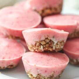 Skinny Frozen Strawberry Bites stacked on a plate