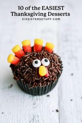 A cupcake decorated as a turkey with candy corn feathers, chocolate sprinkles, and candy eyes on a white surface. Text above reads: "10 of the EASIEST Thanksgiving Desserts" and "SIXSISTERSTUFF.COM".