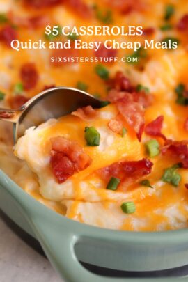 A casserole dish filled with a cheesy, baked meal topped with green onions and bacon bits, with a spoon scooping out a portion.