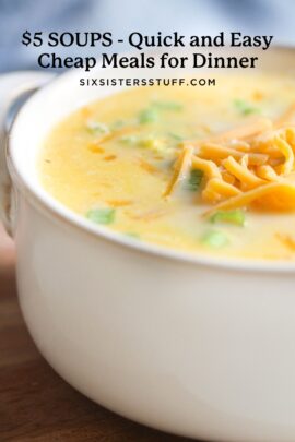 Close-up of a bowl of creamy soup topped with shredded cheese.