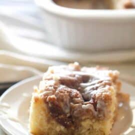 A slice of Cinnabon Cinnamon Roll Cake on a plate