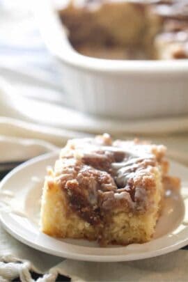 A slice of Cinnabon Cinnamon Roll Cake on a plate