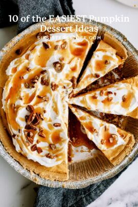 A sliced pumpkin pie topped with whipped cream, caramel sauce, and pecan pieces.
