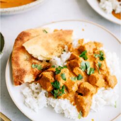 Instant Pot Chicken Tikka Masala on a plate with naan bread