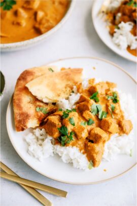 Instant Pot Chicken Tikka Masala on a plate with naan bread