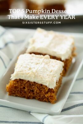 Image of two pumpkin dessert bars with frosting on a white plate.