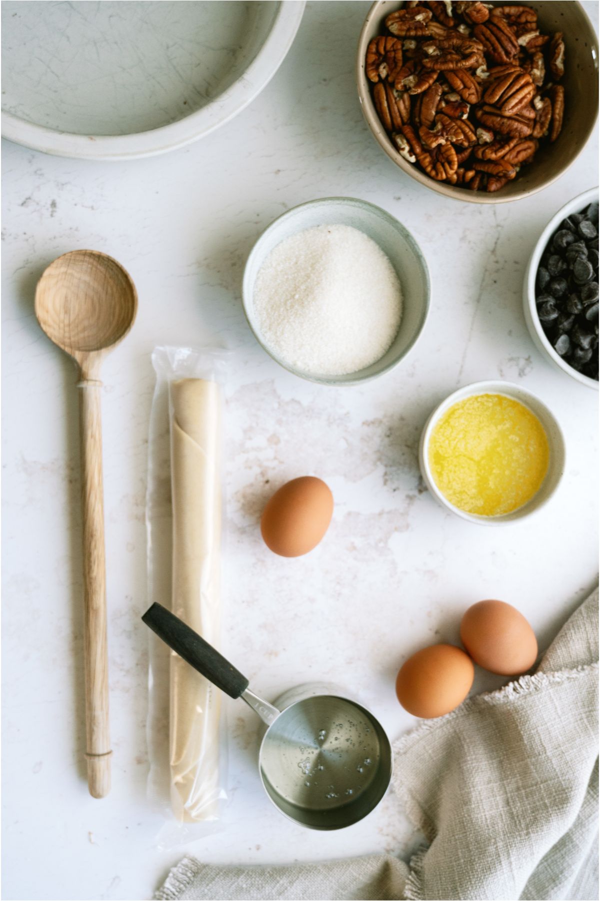 Ingredients needed to make Chocolate Pecan Pie.