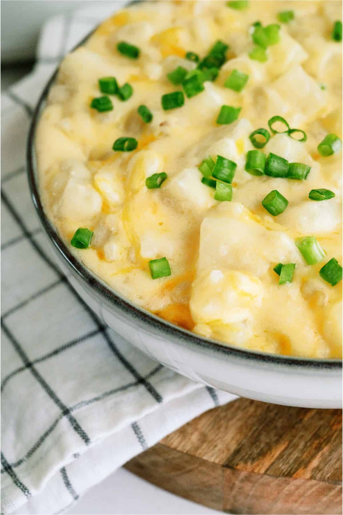 Slow Cooker Cheesy Potatoes in a serving bowl