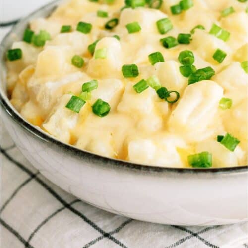 Slow Cooker Cheesy Potatoes in a serving bowl