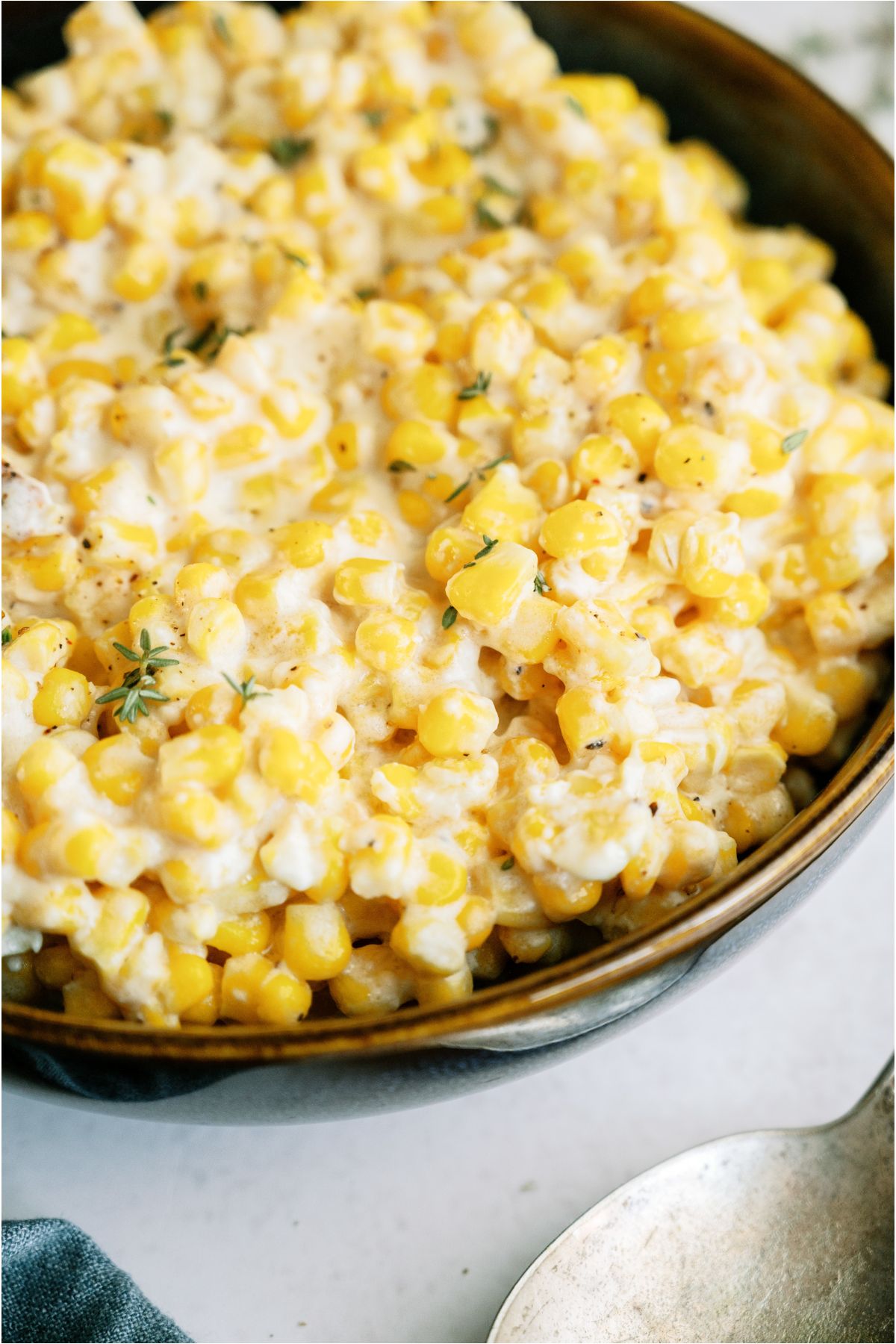 Close up of Slow Cooker Creamed Corn in a serving bowl.