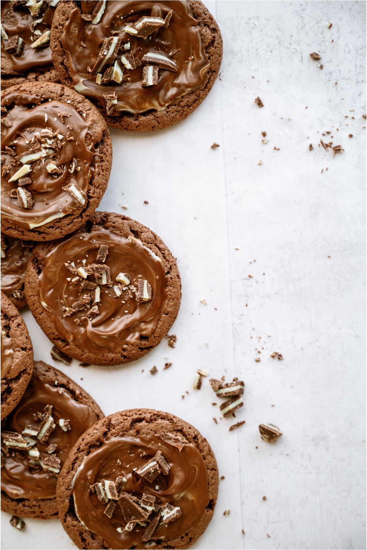 Andes Mint Cookies topped with crushed mints stacked around the outer edge of the photo.