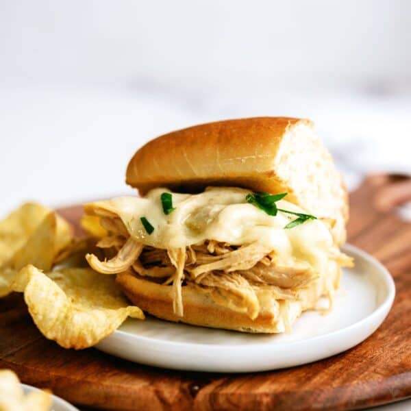 instant pot chicken french dip sandwiches on a plate with chips
