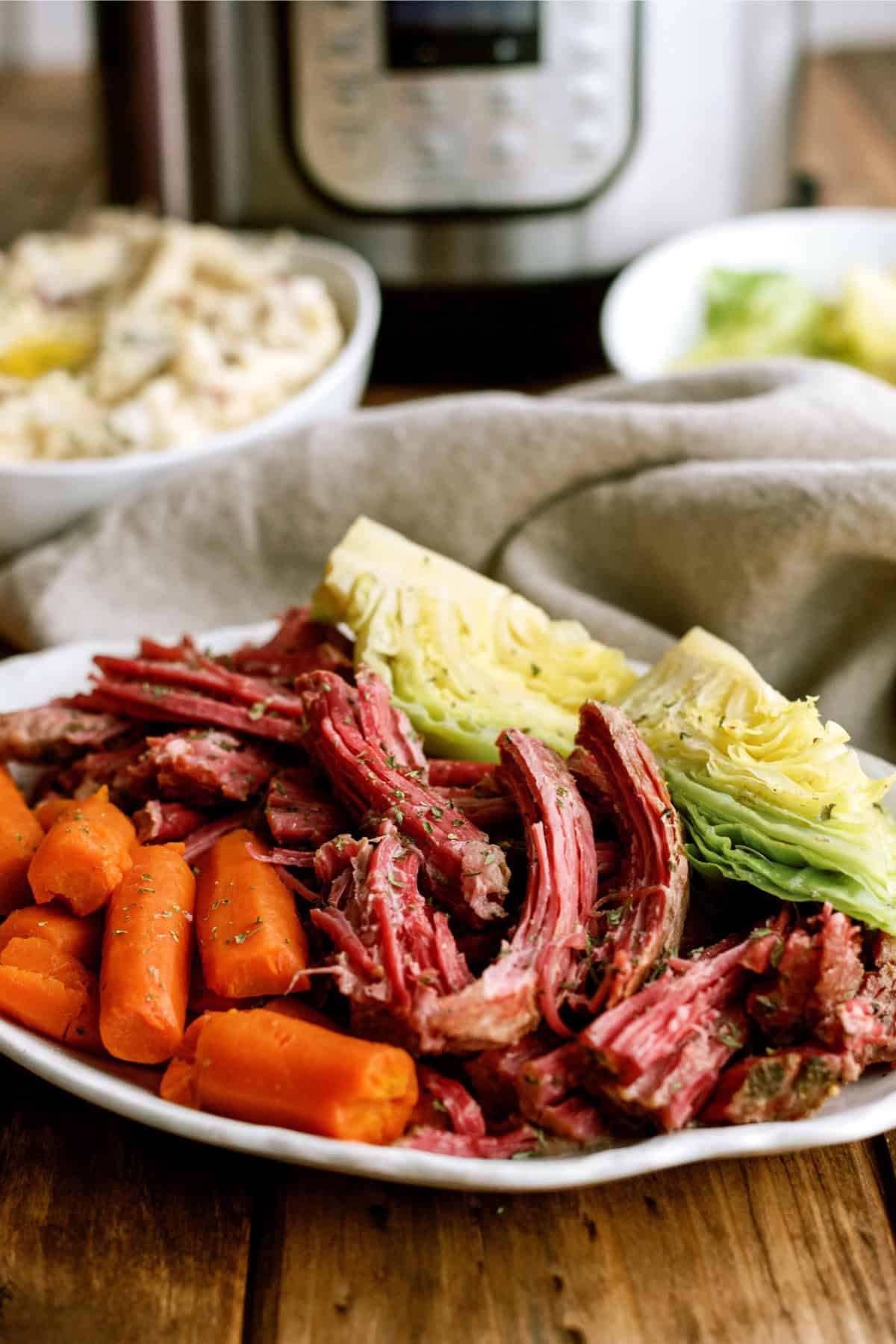 A serving of Instant Pot Corned Beef and Cabbage on  a plate