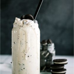 Copycat Dairy Queen Blizzard in a glass surrounded by Oreo cookies