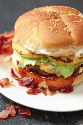 Bacon Infused Burger on a plate with toppings
