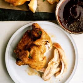 slow cooker bbq chicken thighs on a plate