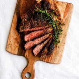 steak slices on wood cutting board