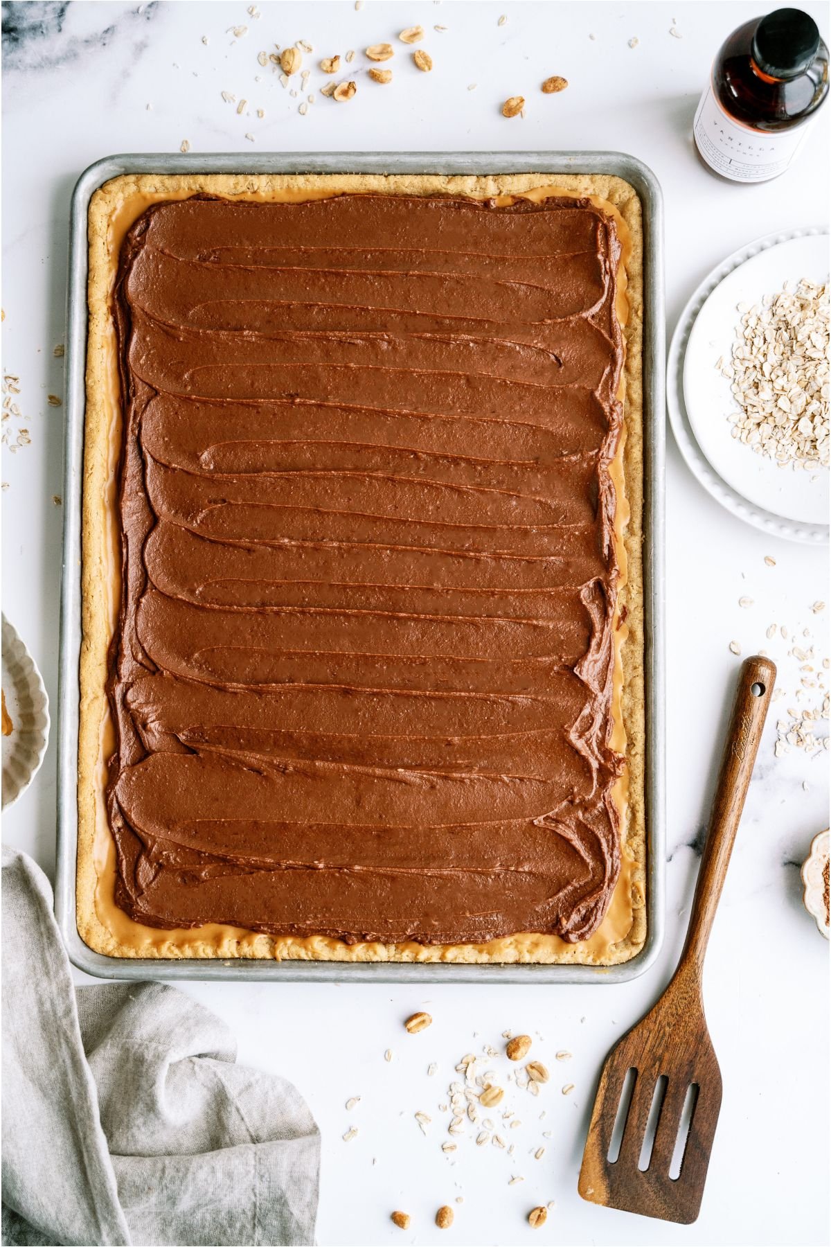 Top view of a pan of Lunch Lady Peanut Butter Bars with a serving spatula off to the side.