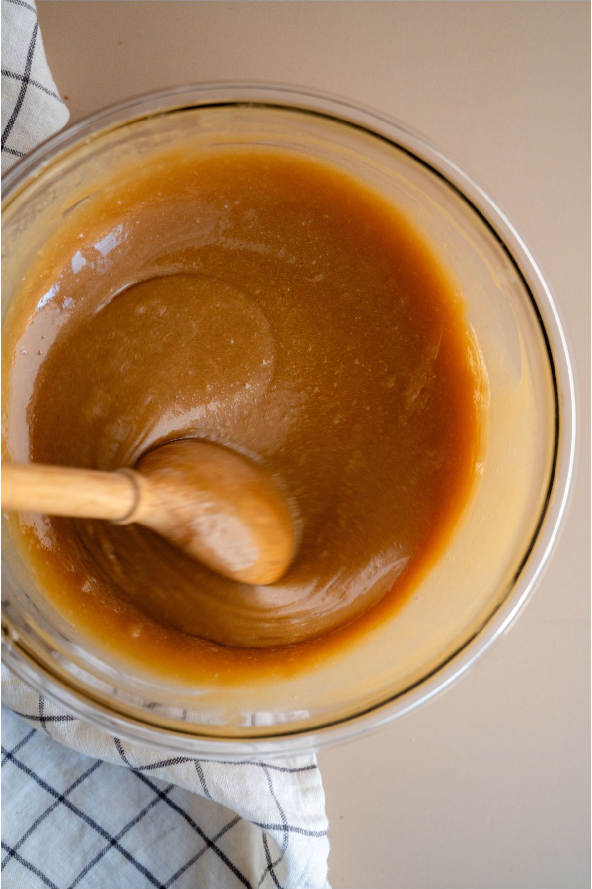 Final stir of all ingredients in a mixing bowl with a wooden spoon.