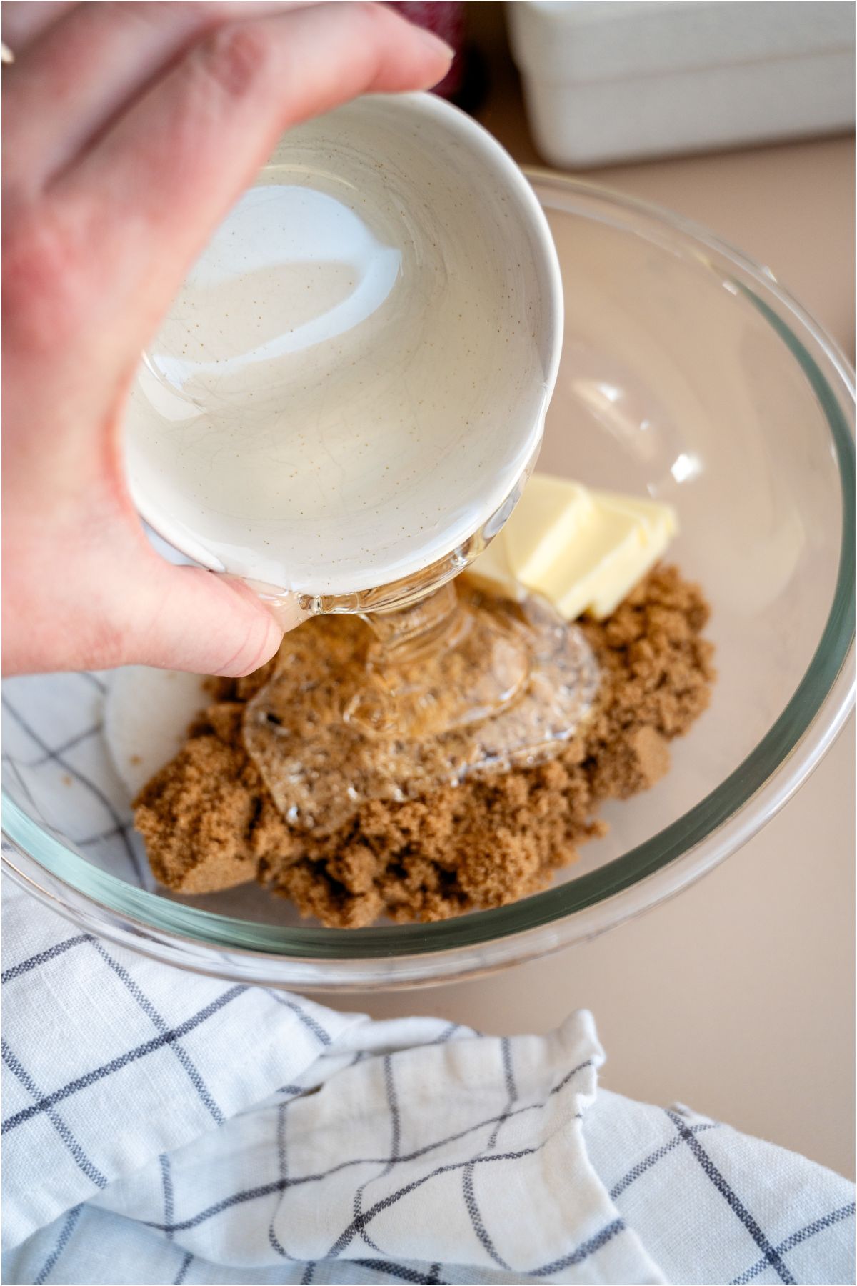 Combining all ingredients in a glass mixing bowl.