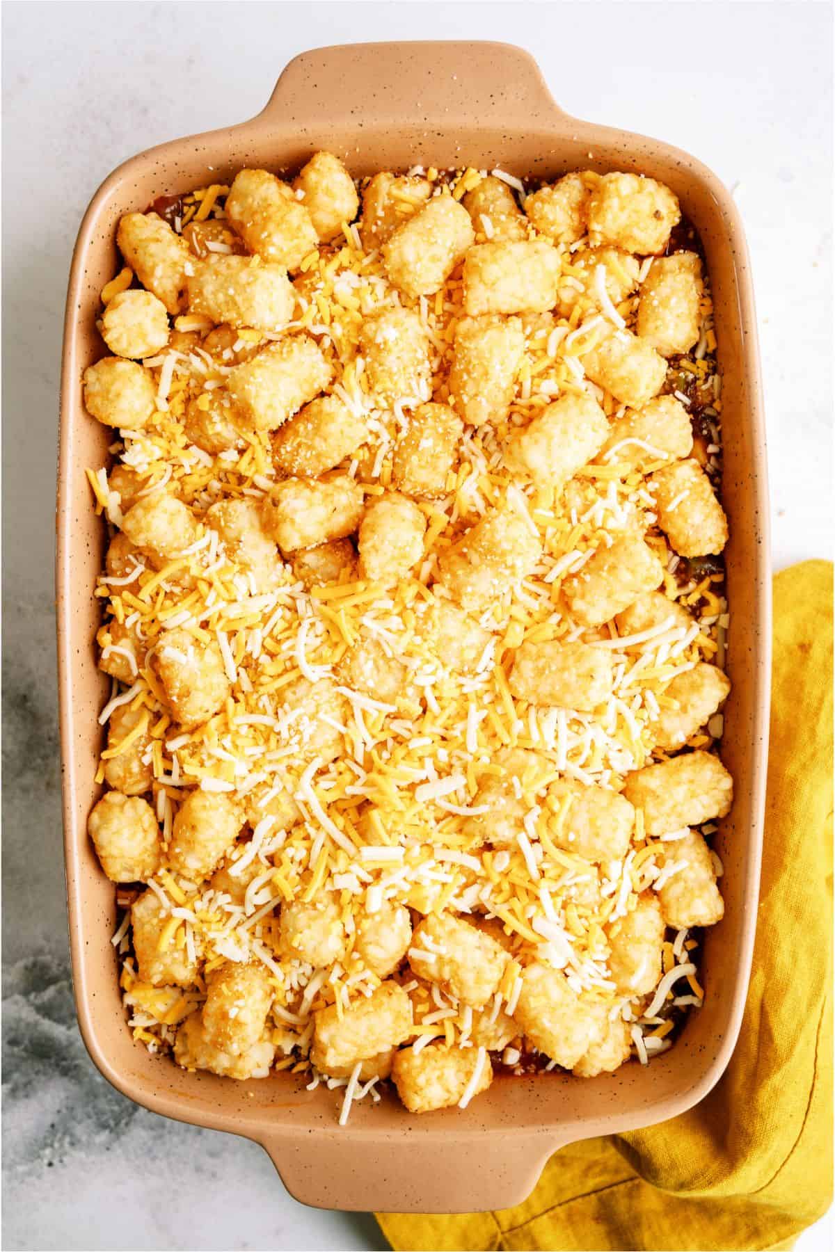 Unbaked BBQ Tater Tot Casserole in casserole dish