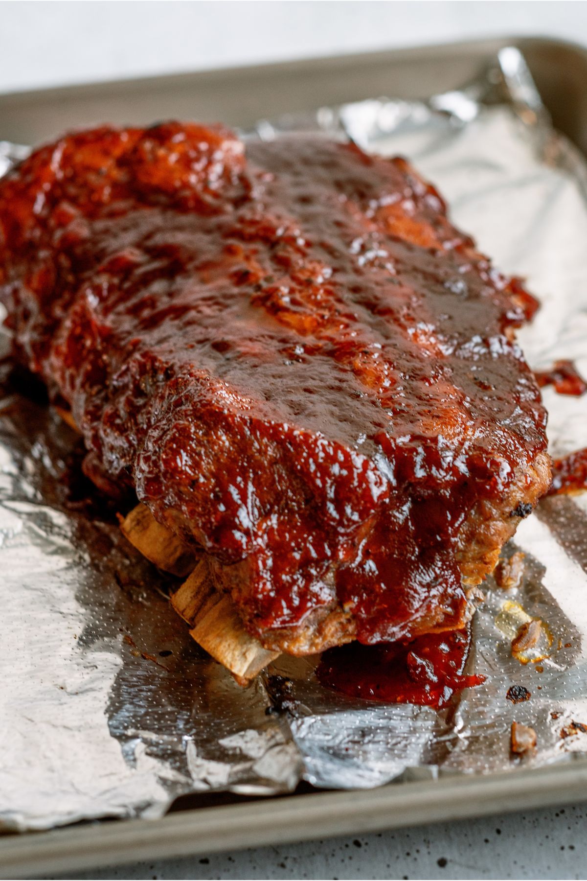 Instant Pot Fall Off the Bone BBQ Ribs on a baking sheet